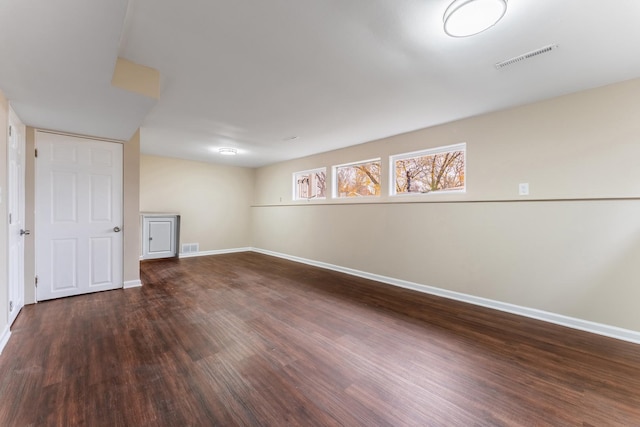 basement featuring dark hardwood / wood-style floors