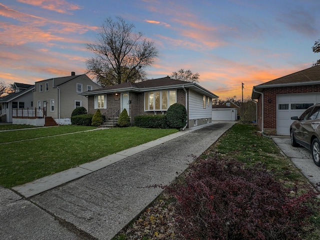 view of front of home featuring a yard and a garage