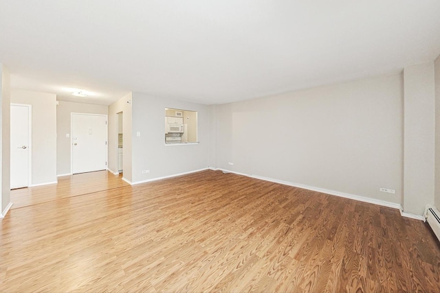 unfurnished room featuring hardwood / wood-style floors