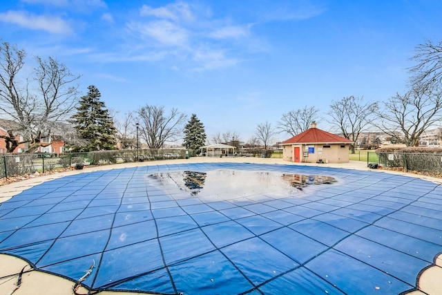 view of pool with an outbuilding