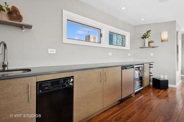 kitchen with white cabinets, kitchen peninsula, backsplash, hanging light fixtures, and appliances with stainless steel finishes