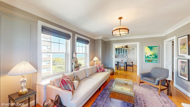 interior space with hardwood / wood-style flooring and ornamental molding