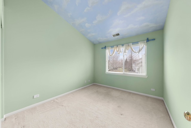 unfurnished room featuring light carpet