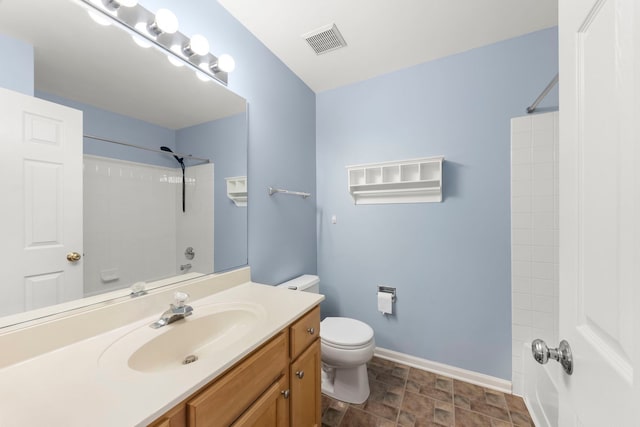 full bathroom with shower / washtub combination, vanity, and toilet