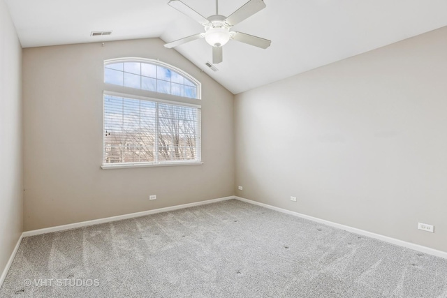 empty room with ceiling fan, carpet, and lofted ceiling