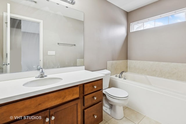 bathroom featuring tile patterned floors, vanity, toilet, and a tub to relax in