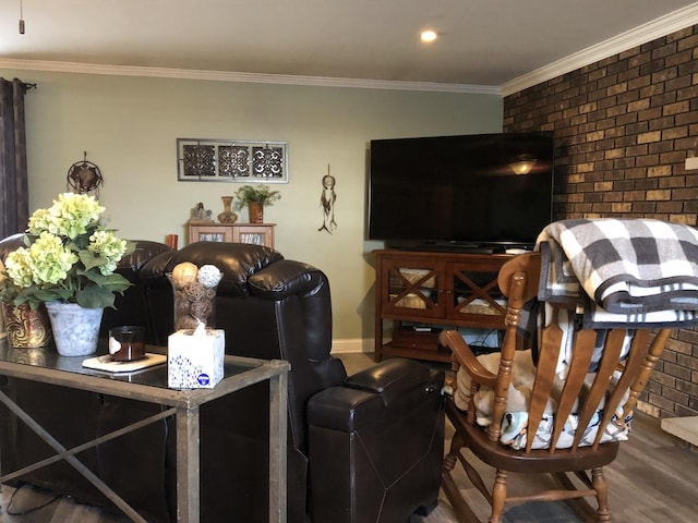 living room with hardwood / wood-style flooring and crown molding