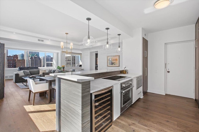 kitchen with wine cooler, black electric cooktop, a raised ceiling, dark hardwood / wood-style floors, and oven