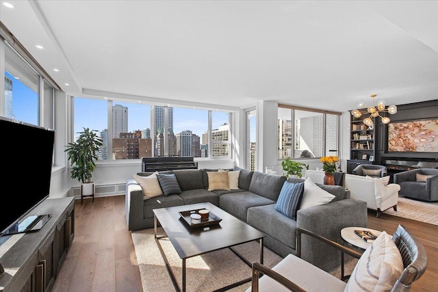 living room featuring hardwood / wood-style flooring and a notable chandelier