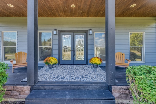 property entrance featuring french doors and a porch