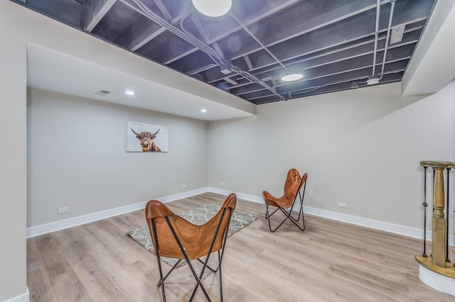 sitting room featuring hardwood / wood-style floors