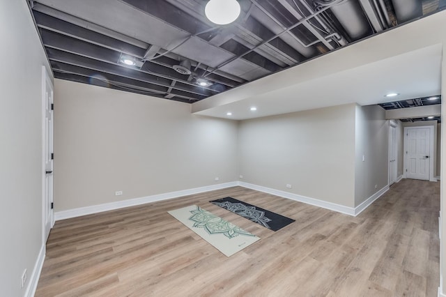 basement featuring light wood-type flooring