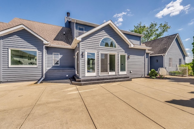 rear view of property with a patio area