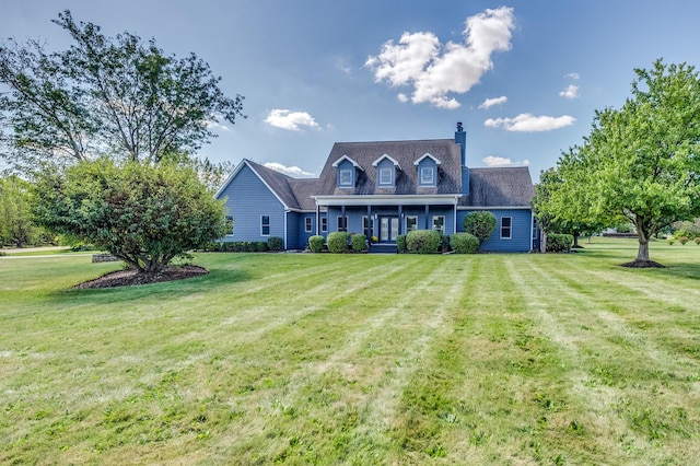 cape cod house featuring a front lawn and a porch