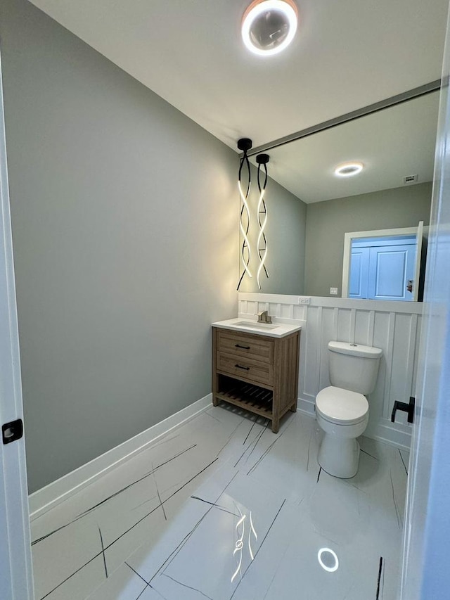 bathroom with vanity and toilet