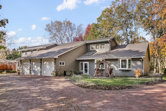 view of front facade with a garage and a front yard