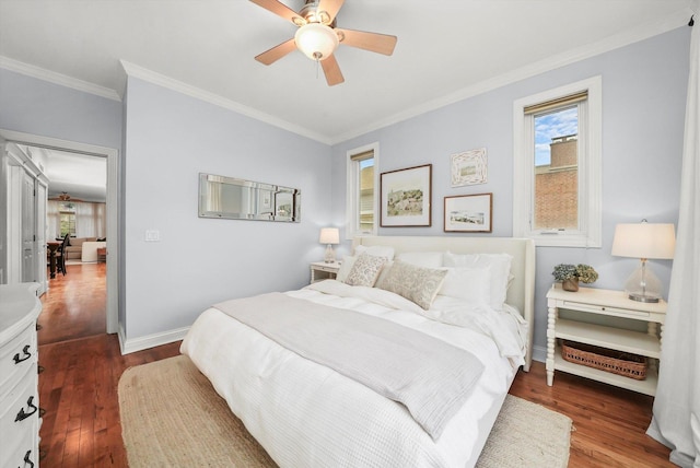 bedroom featuring ceiling fan, hardwood / wood-style floors, and crown molding