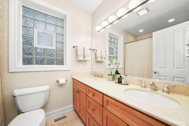 bathroom with tile patterned flooring, vanity, toilet, and a shower with shower curtain