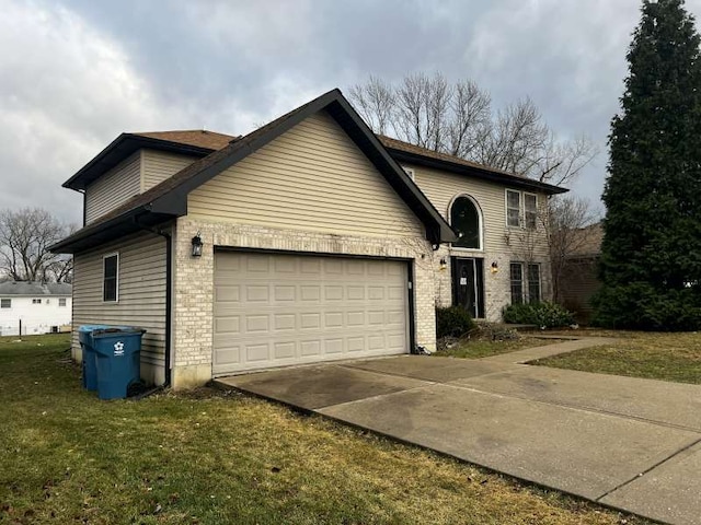 view of front of home with a garage and a front yard