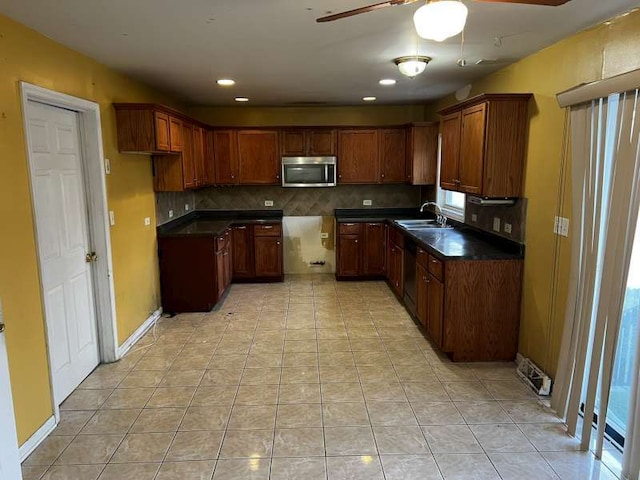 kitchen with decorative backsplash, sink, ceiling fan, and light tile patterned flooring