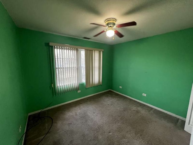 unfurnished room featuring carpet floors and ceiling fan