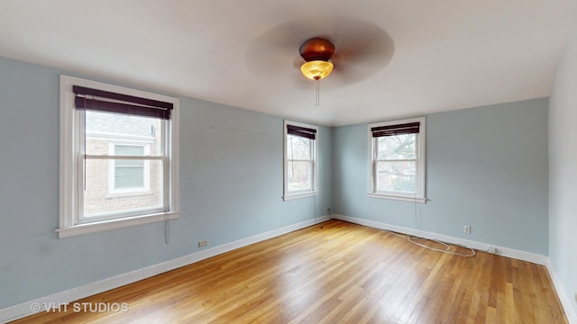 empty room featuring light wood-type flooring and ceiling fan