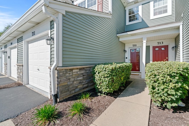 property entrance with a garage