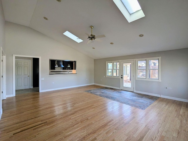 unfurnished living room featuring light hardwood / wood-style floors, vaulted ceiling, and ceiling fan