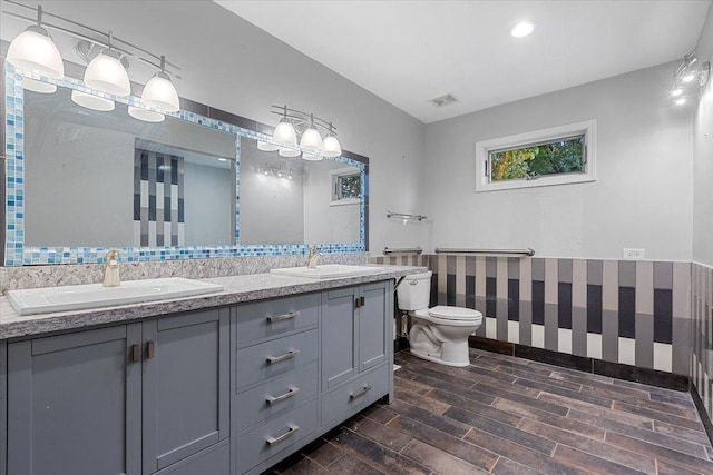 bathroom featuring vanity and toilet