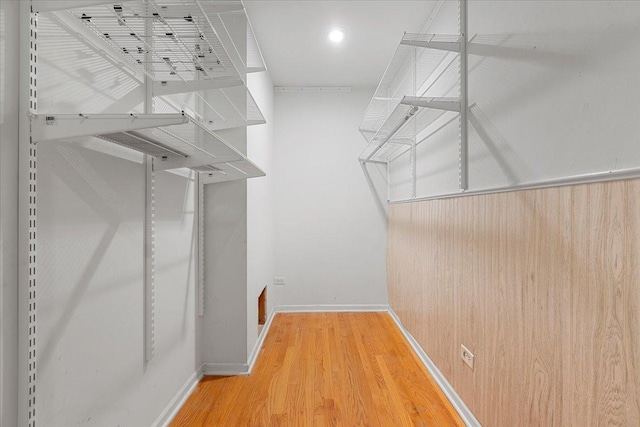 walk in closet featuring hardwood / wood-style floors