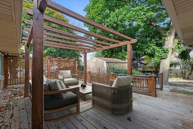 wooden deck with an outdoor hangout area and a pergola