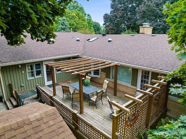 back of property with a pergola, central AC unit, and a deck