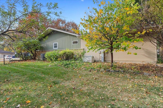 view of property exterior featuring a lawn