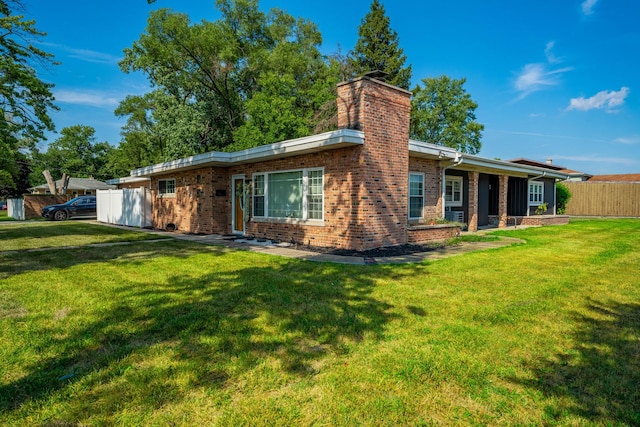 back of house with a yard