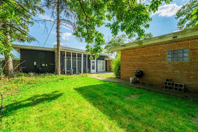 view of yard featuring a sunroom