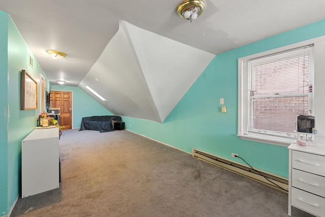 bedroom with carpet flooring, lofted ceiling, and a baseboard radiator