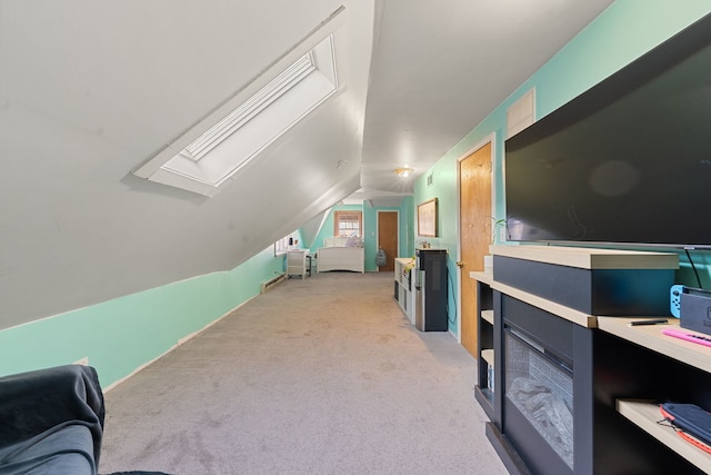 additional living space featuring light colored carpet and vaulted ceiling