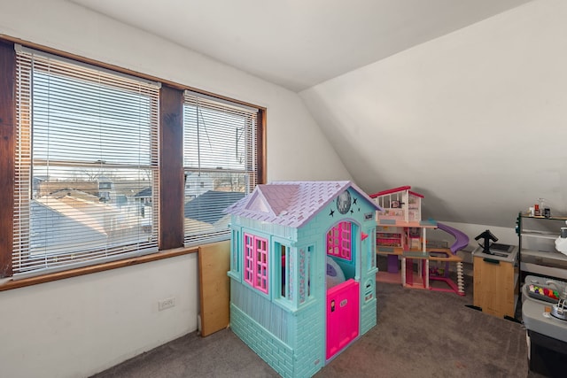 playroom with carpet flooring and vaulted ceiling