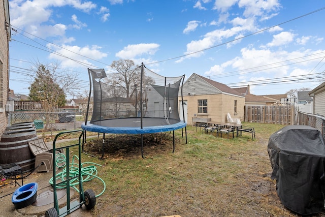 view of yard featuring a trampoline