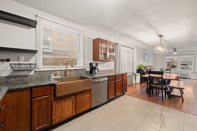 kitchen featuring pendant lighting, dishwasher, sink, ceiling fan, and radiator heating unit