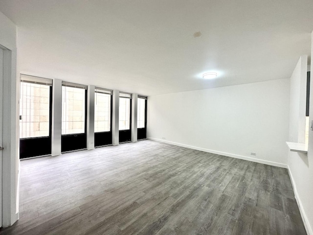 unfurnished room featuring hardwood / wood-style floors