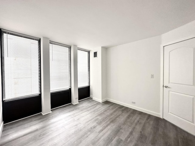 empty room with light hardwood / wood-style floors