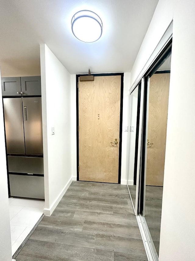 corridor featuring hardwood / wood-style floors