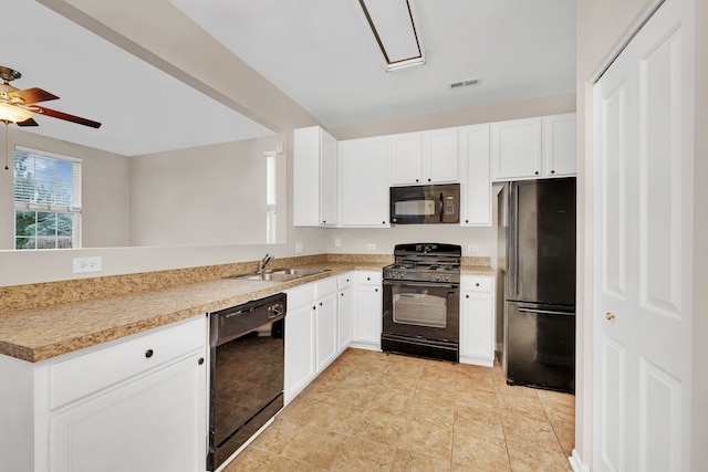 kitchen with black appliances, ceiling fan, white cabinetry, and sink