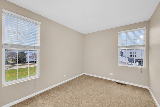 spare room with carpet flooring