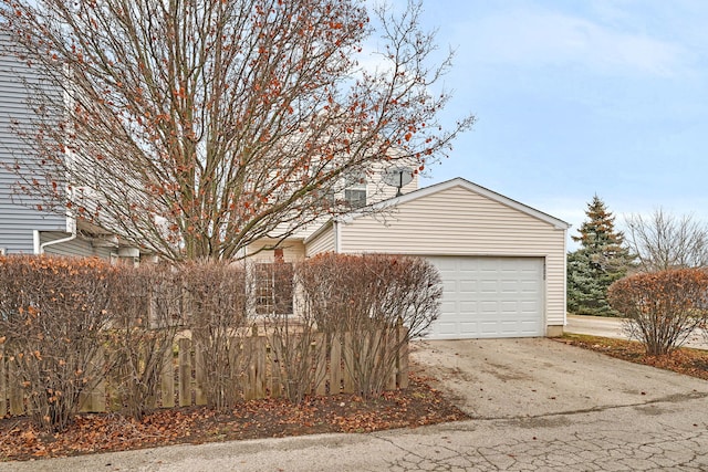 view of property exterior with a garage