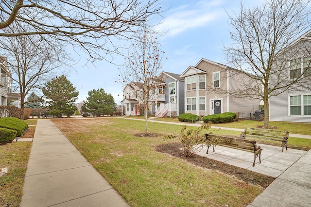 view of home's community featuring a yard