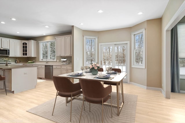 dining area featuring light wood-type flooring