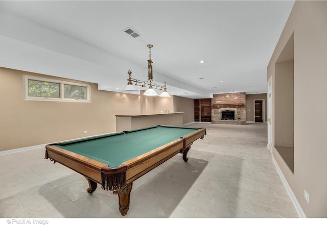 game room with a large fireplace and billiards