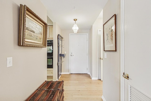 hallway featuring light wood-type flooring